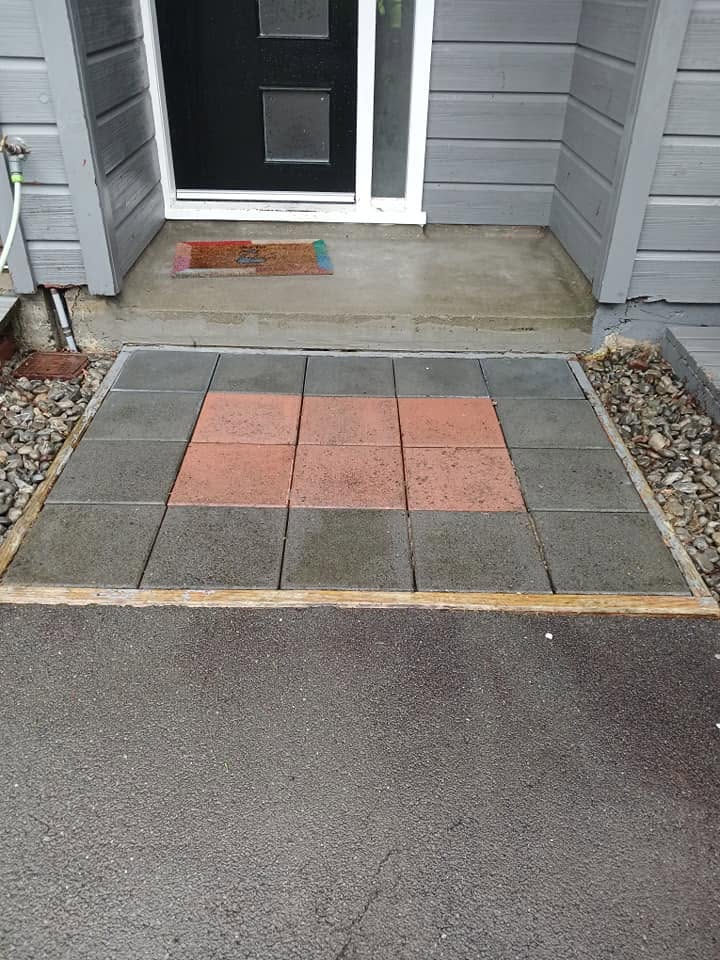 Freshly washed paving and exterior at a property entrance